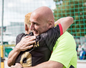Hary Milas giving the Whistle of Hope to a player
